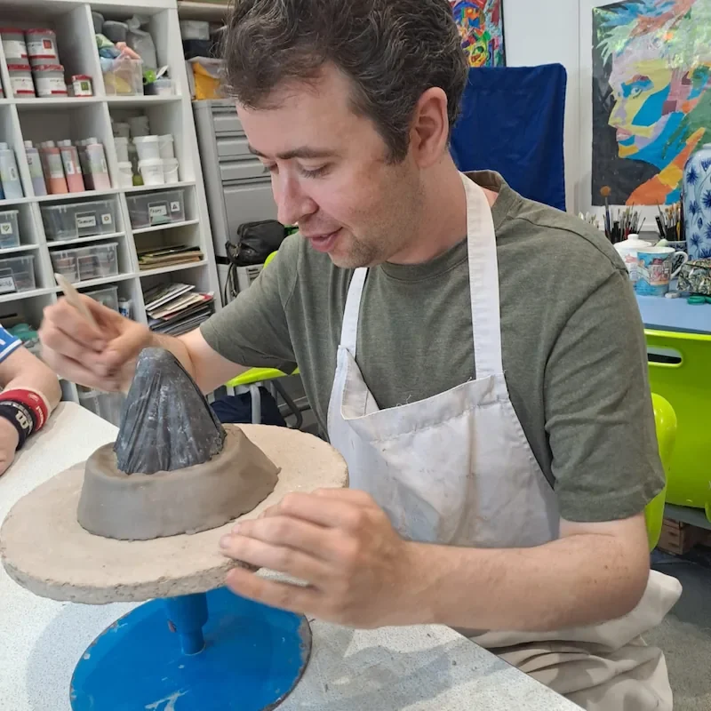 Disability & Special Needs Care—creative life-skills support in Maidstone & Kent A client with support from his care team engaging in pottery sculpting at an arts workshop