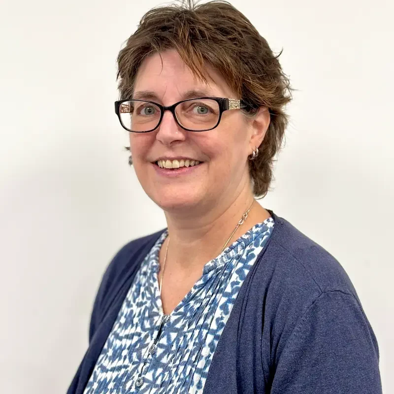 Nikki Mackay – Clinical Manager Nikki Mackay, Clinical Manager at Continuity of Care Services, smiling against a soft white background.